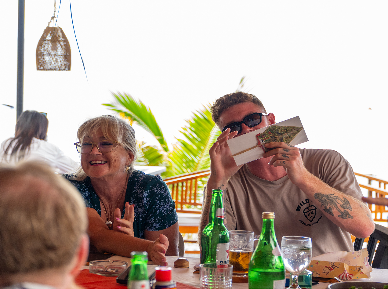 Guests sharing drinks and laughter at Barak Rooftop and Bar
