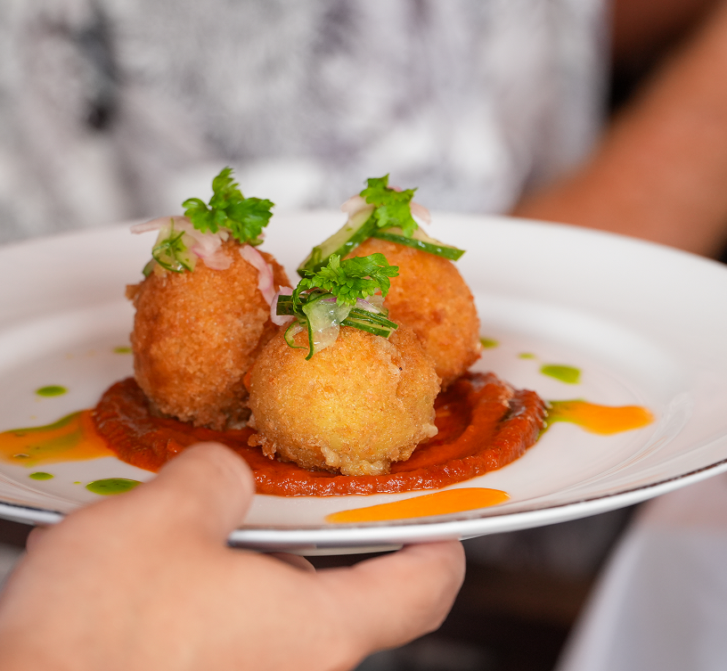 Croquettes plated with herbs